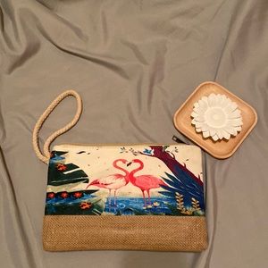 Cute canvas flamingo wristlet with inside pocket and zipper closure.